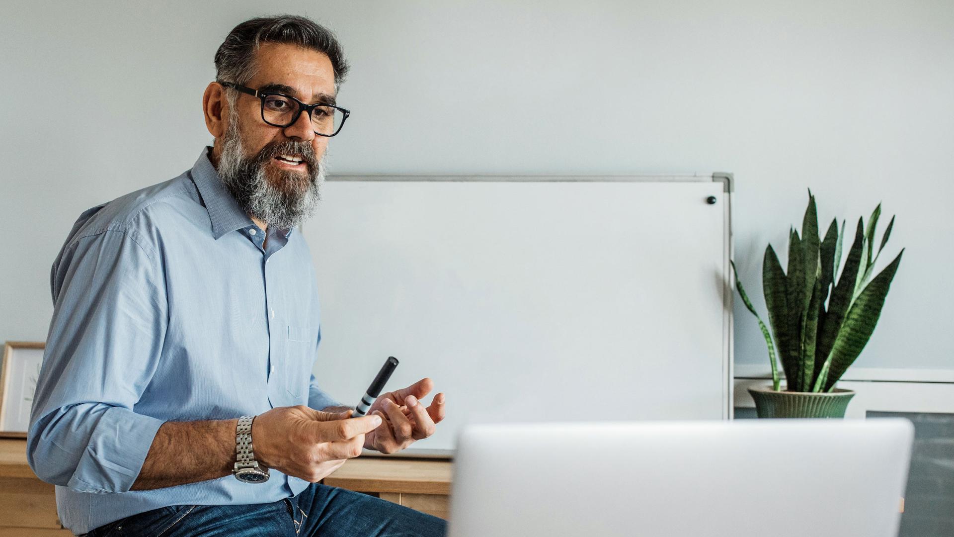 Educator at laptop