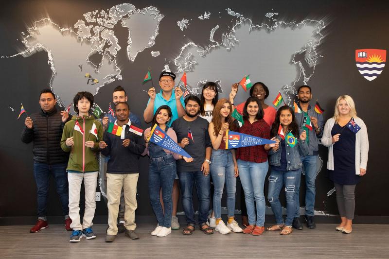 Lakehead University International Students Waving International Flags