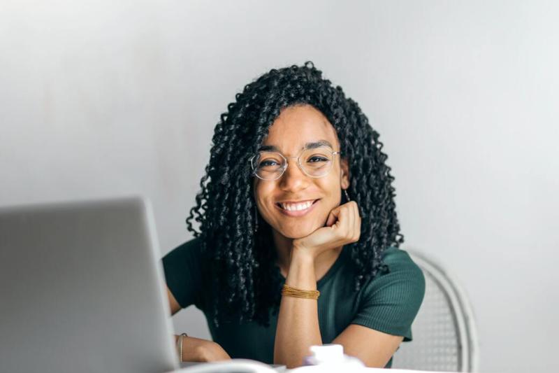 Women wearing glasses at a laptop